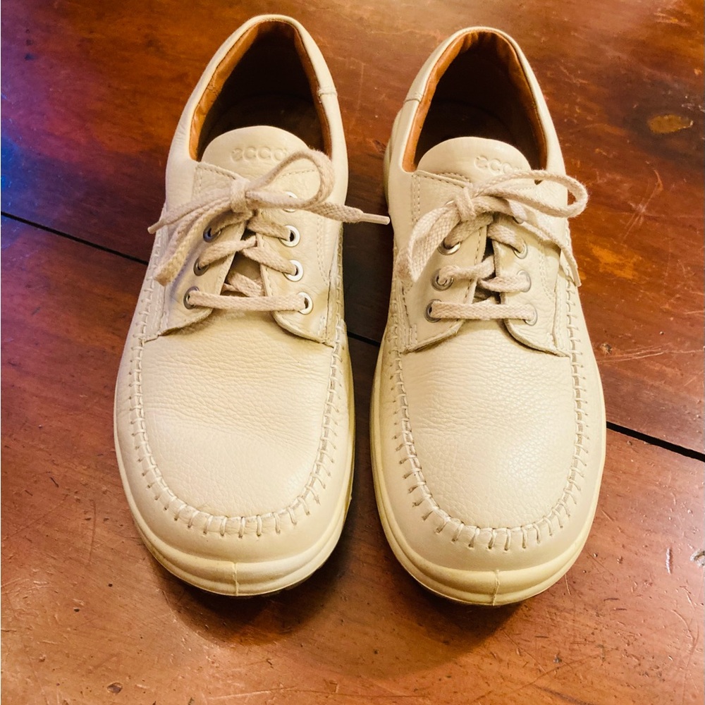 Ecco pair of creamy white leather sneakers lace up topstitch uppers made Spain